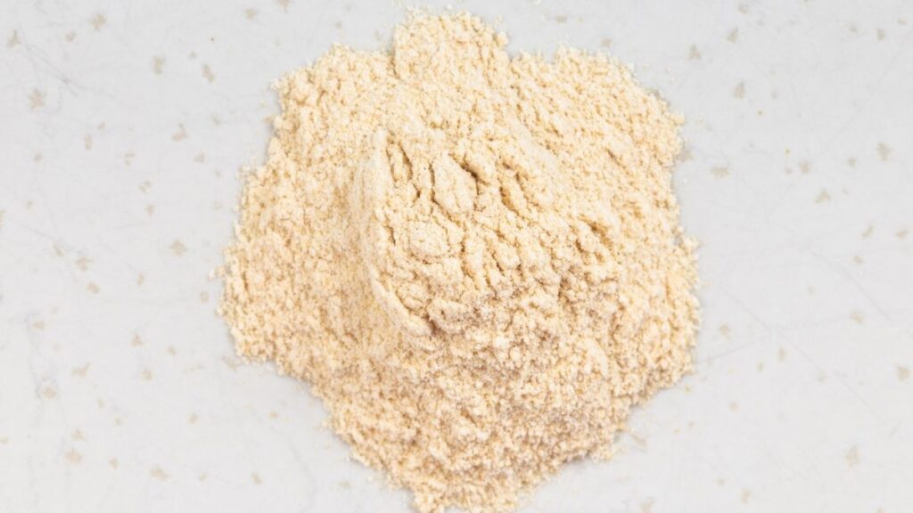 Fine blend of Turkish apple tea powder on a white surface - authentic Turkish apple tea powder recipe for making sweet and fruity tea at home.